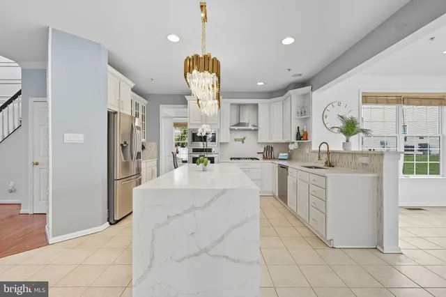 a kitchen with cabinets and window