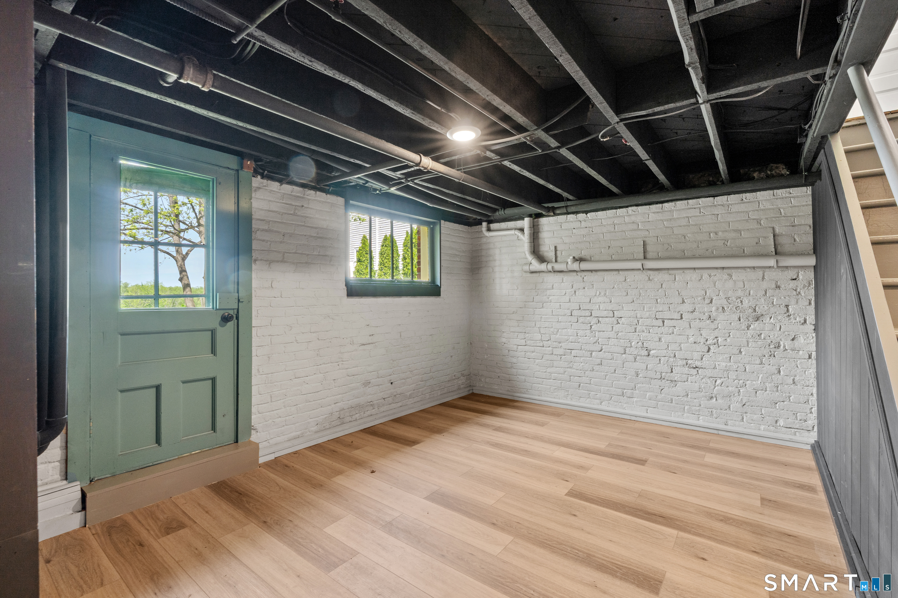 551 North Main Street Suffield, CT 06078 - Photo 30 of 38 Finished basement space perfect for a home office.