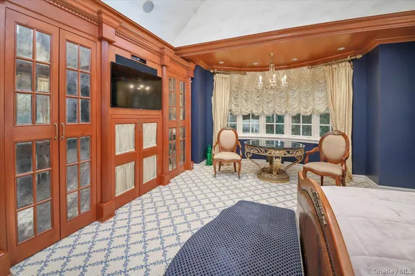 a living room filled with furniture hardwood floor and a large window