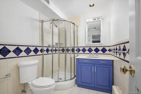 a bathroom with a shower curtain and a sink