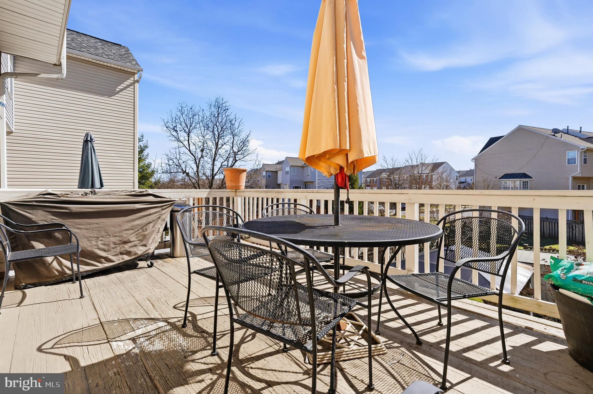 137 Harpers Way Frederick, MD 21702 - Photo 14 of 28 a view of a patio with a table and chairs and potted plants