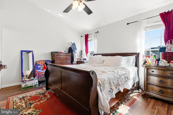 a bathroom with a sink a toilet and a large mirror