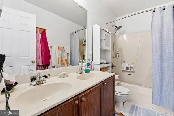 a view of a house with backyard porch and sitting area