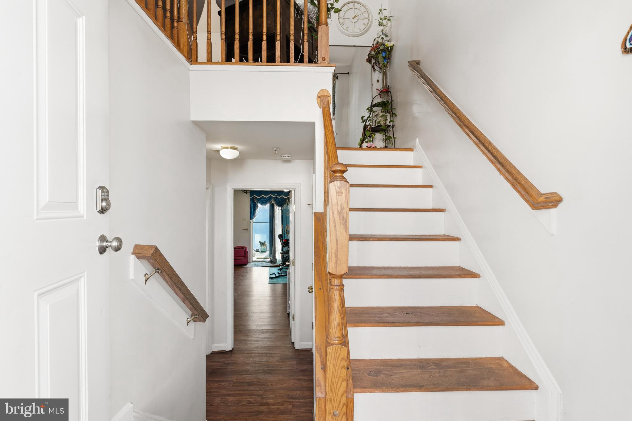 137 Harpers Way Frederick, MD 21702 - Photo 2 of 28 a view of entryway and hall with wooden floor
