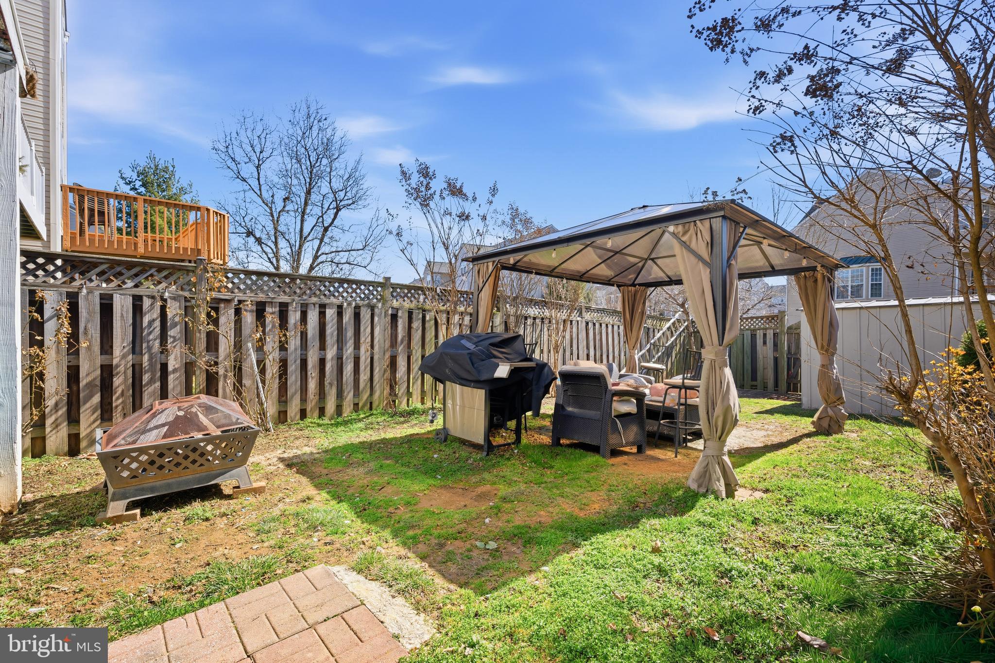 137 Harpers Way Frederick, MD 21702 - Photo 22 of 28 a view of a chair and table in backyard of the house