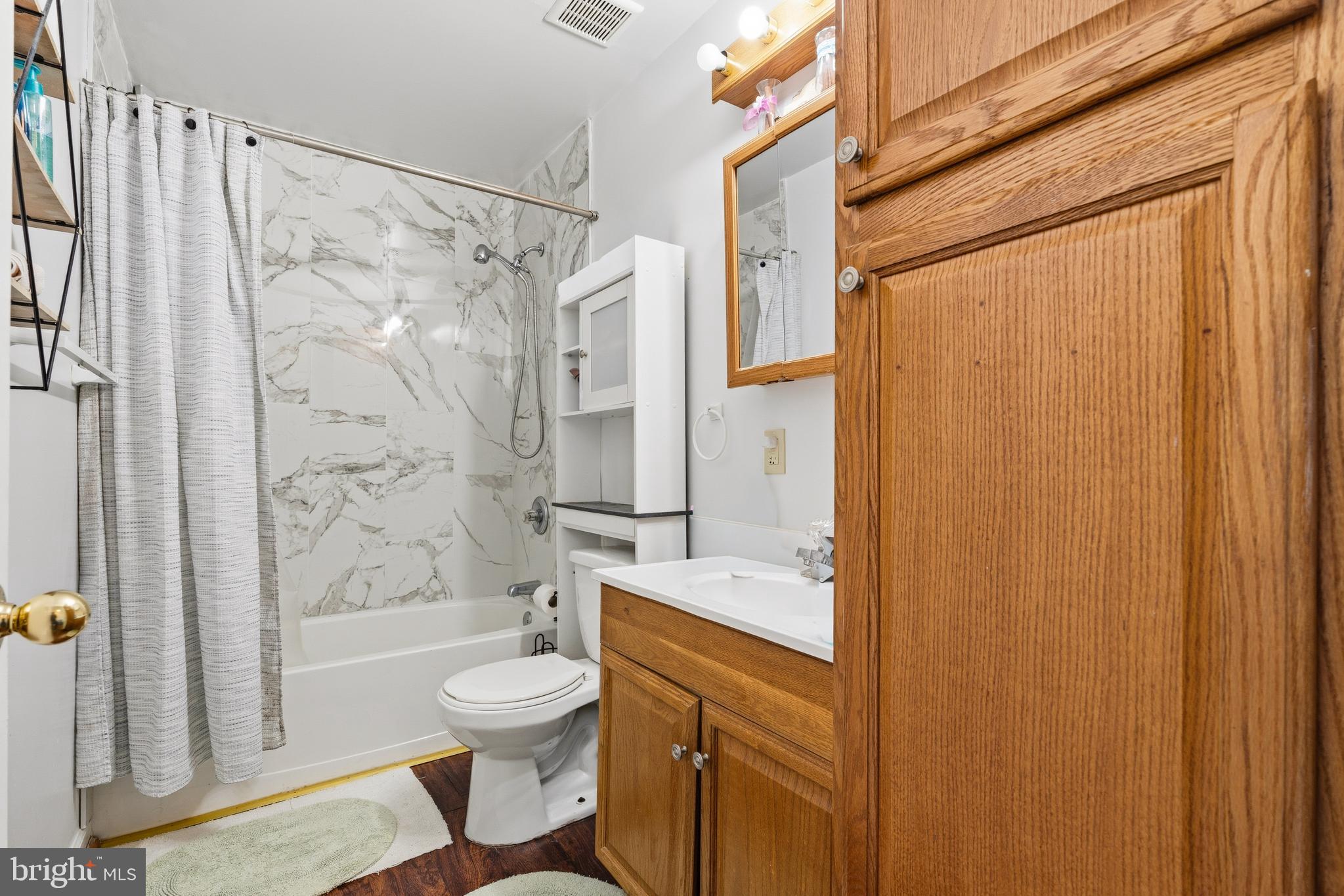 137 Harpers Way Frederick, MD 21702 - Photo 6 of 28 a bathroom with a granite countertop bathtub shower sink vanity and toilet