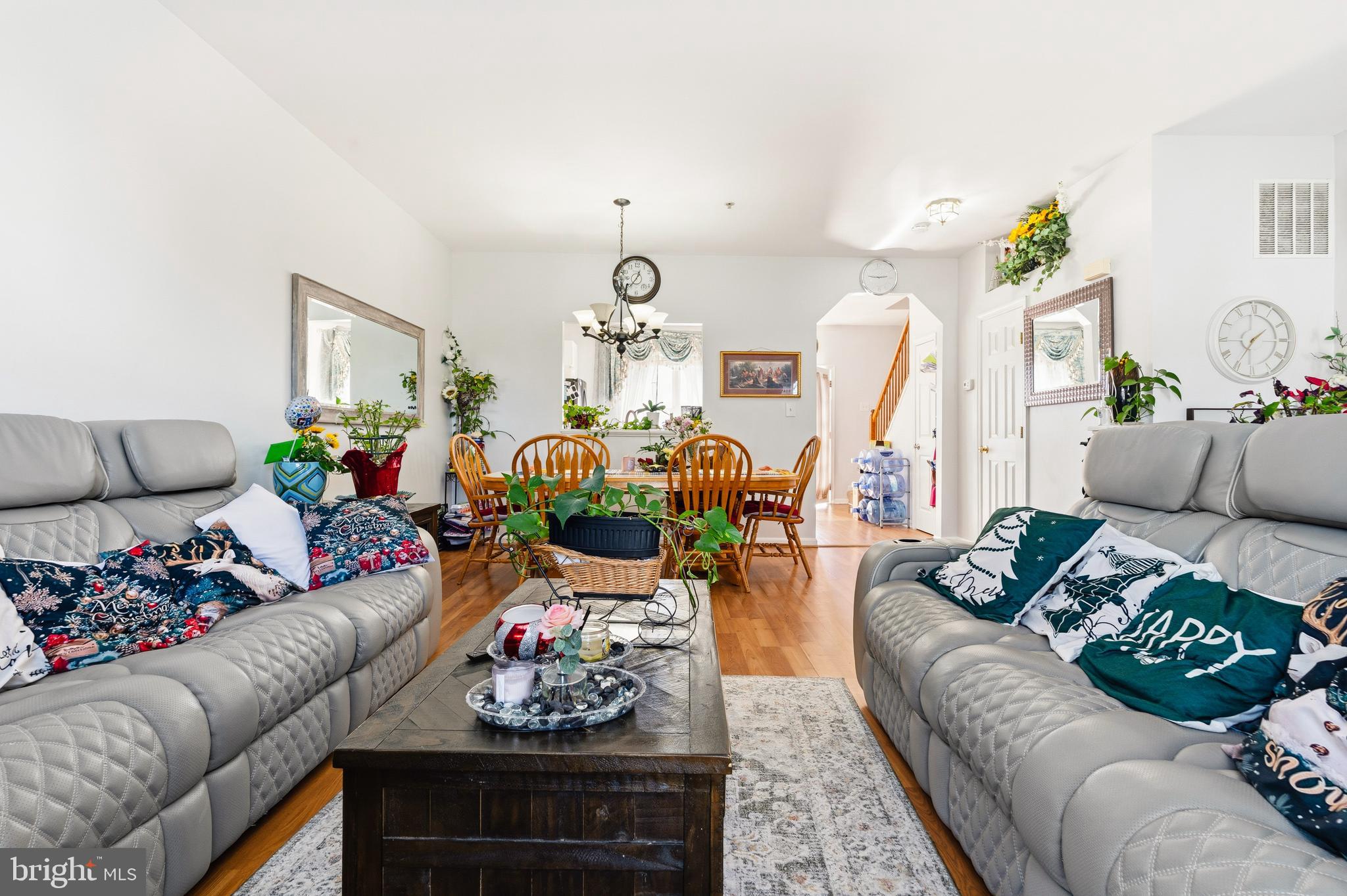 137 Harpers Way Frederick, MD 21702 - Photo 9 of 28 a living room with furniture and flowers