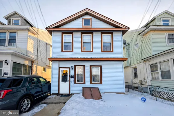 a view of a car park in front of house