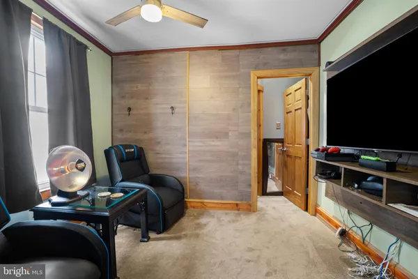 a room with furniture and flat screen tv