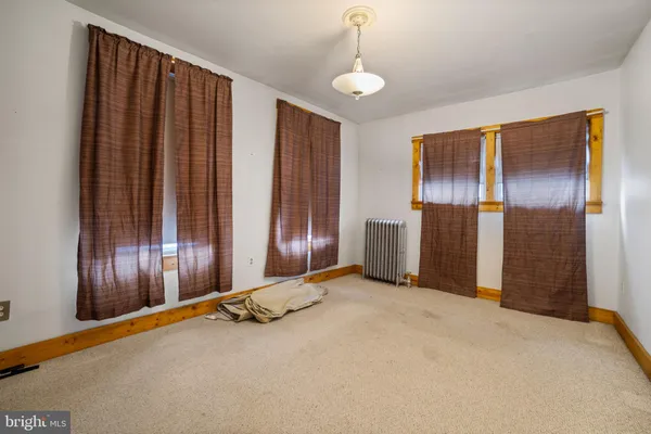 a view of an empty room with windows