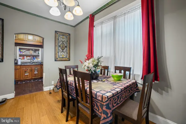 a dining room with furniture and window