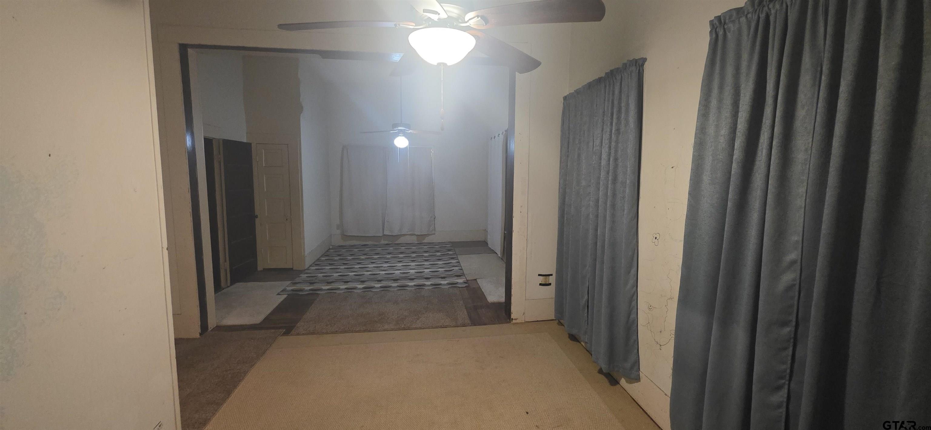 632 Highway 7 Pollok, TX 75969 - Photo 23 of 27 a view of livingroom with hallway and mirror