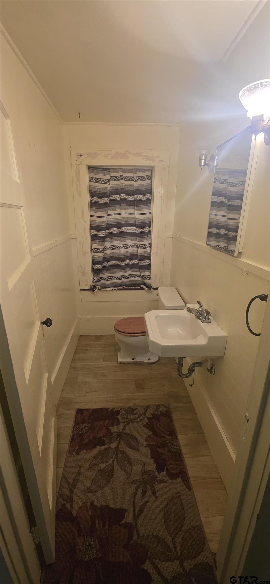 632 Highway 7 Pollok, TX 75969 - Photo 27 of 27 a bathroom with a sink and a mirror