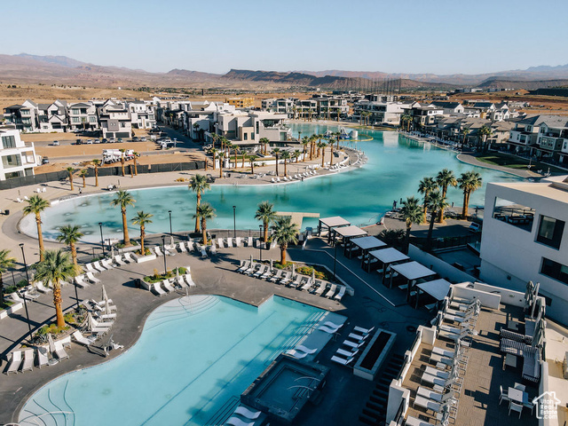 961 West Akoya Pearl Road, Unit 201 St. George, UT 84790 - Photo 34 of 67 Aerial view of residential area featuring a mountainous background and a pool