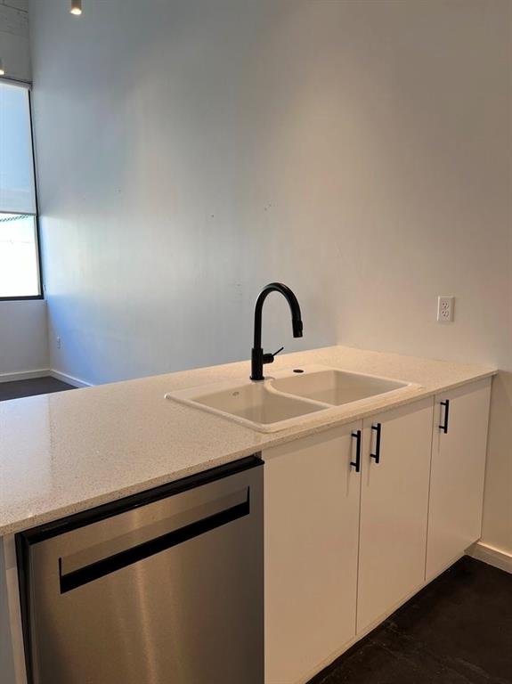 3012 Clover Street, Unit 101 Dallas, TX 75226 - Photo 6 of 15 a close view of a sink a counter space and utility room
