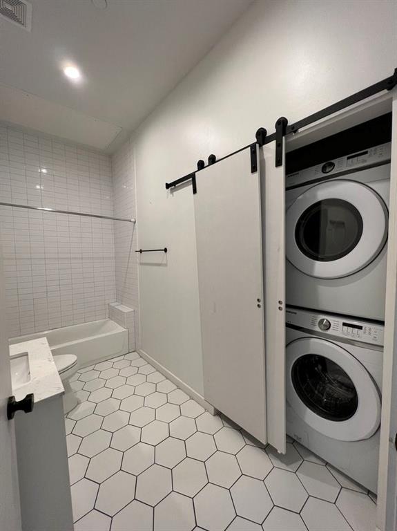 3012 Clover Street, Unit 101 Dallas, TX 75226 - Photo 9 of 15 a utility room with dryer and washer