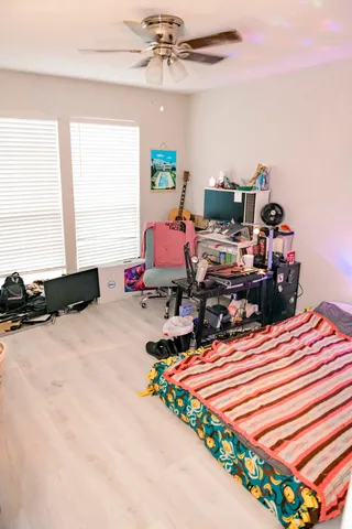 a bed room with furniture and a window