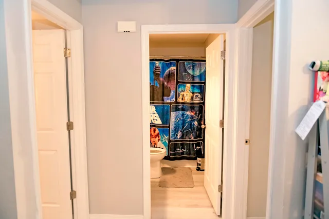 a view of a bedroom from a hallway
