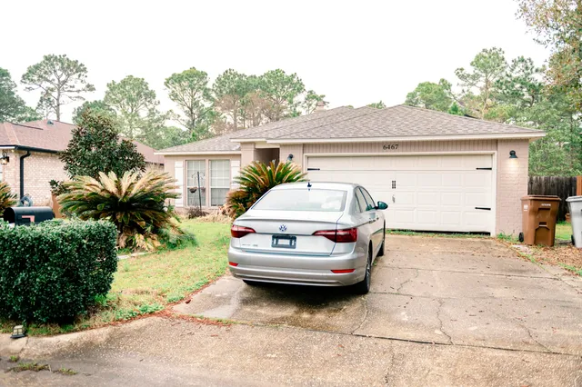 a car parked in front of a house