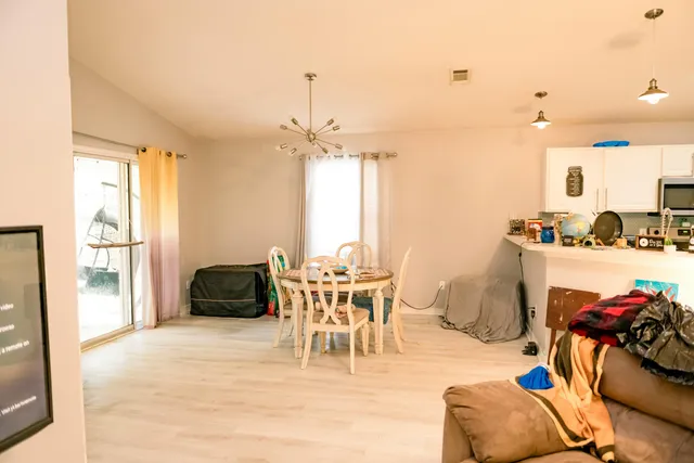 a view of a dining room with furniture window and outside view