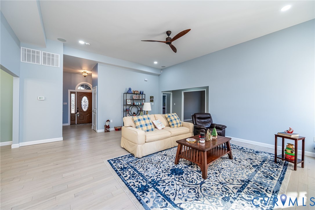 11534 Georgetown Road Mechanicsville, VA 23116 - Photo 12 of 37 a living room with furniture and a rug