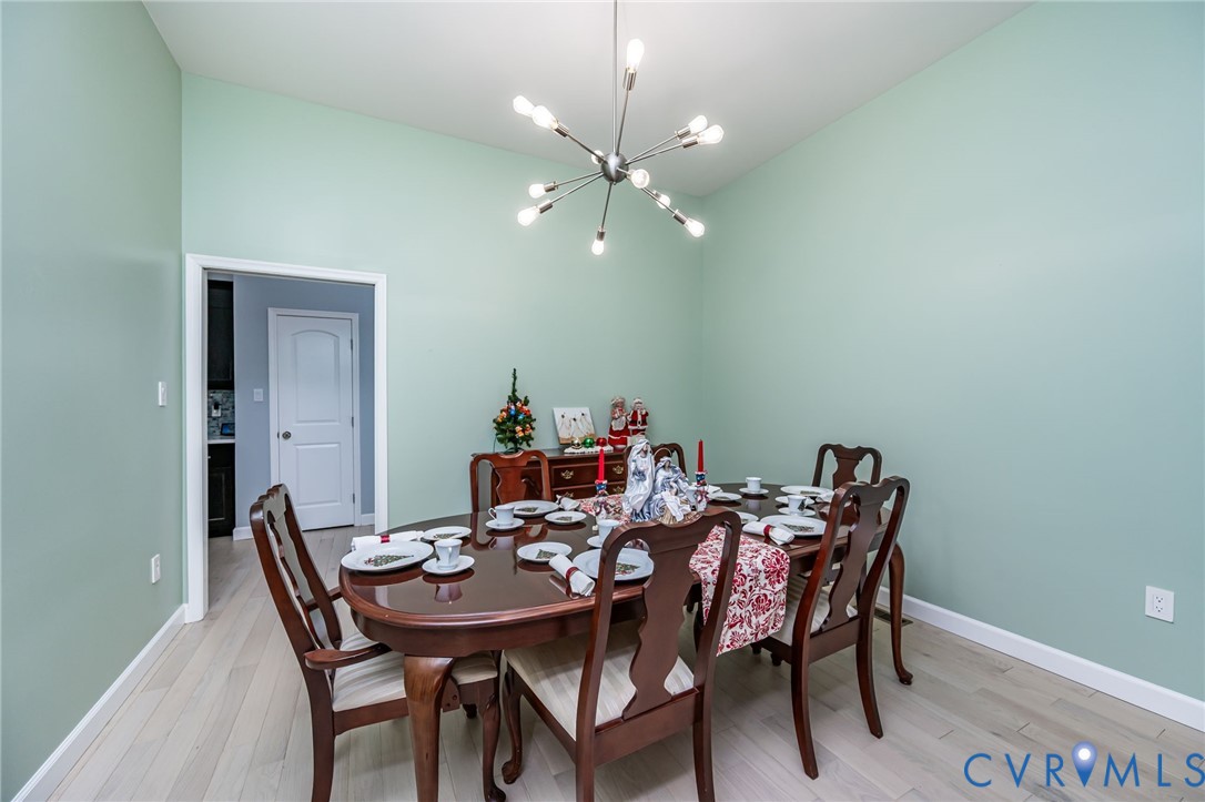 11534 Georgetown Road Mechanicsville, VA 23116 - Photo 13 of 37 a view of a dining room that has a table and chairs
