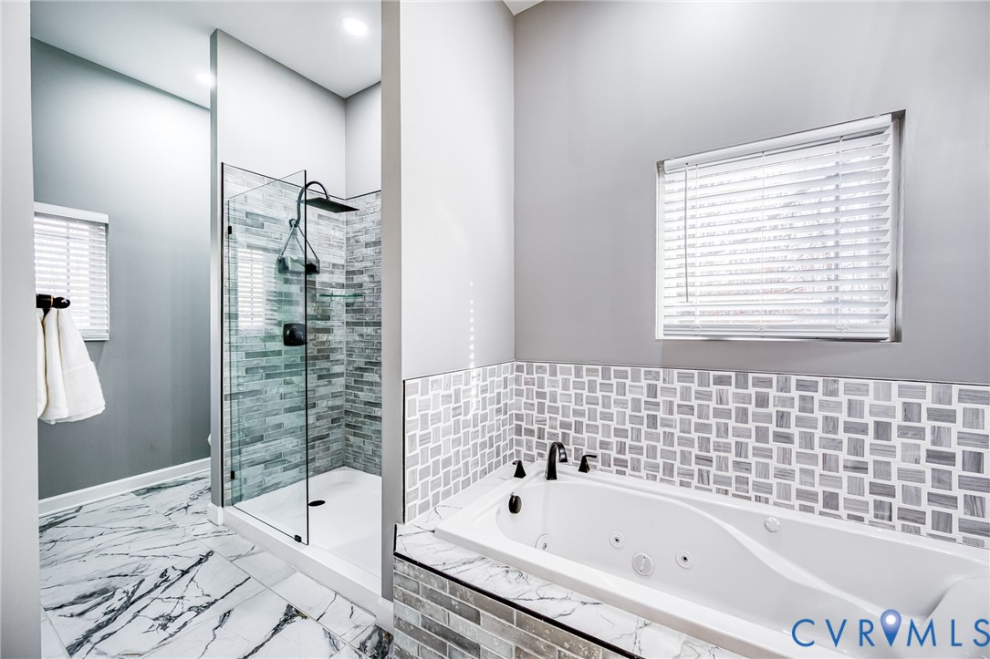 11534 Georgetown Road Mechanicsville, VA 23116 - Photo 20 of 37 a bathroom with a bathtub and shower