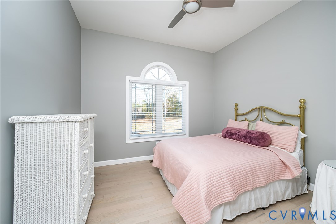 11534 Georgetown Road Mechanicsville, VA 23116 - Photo 21 of 37 a bedroom with a bed and a window