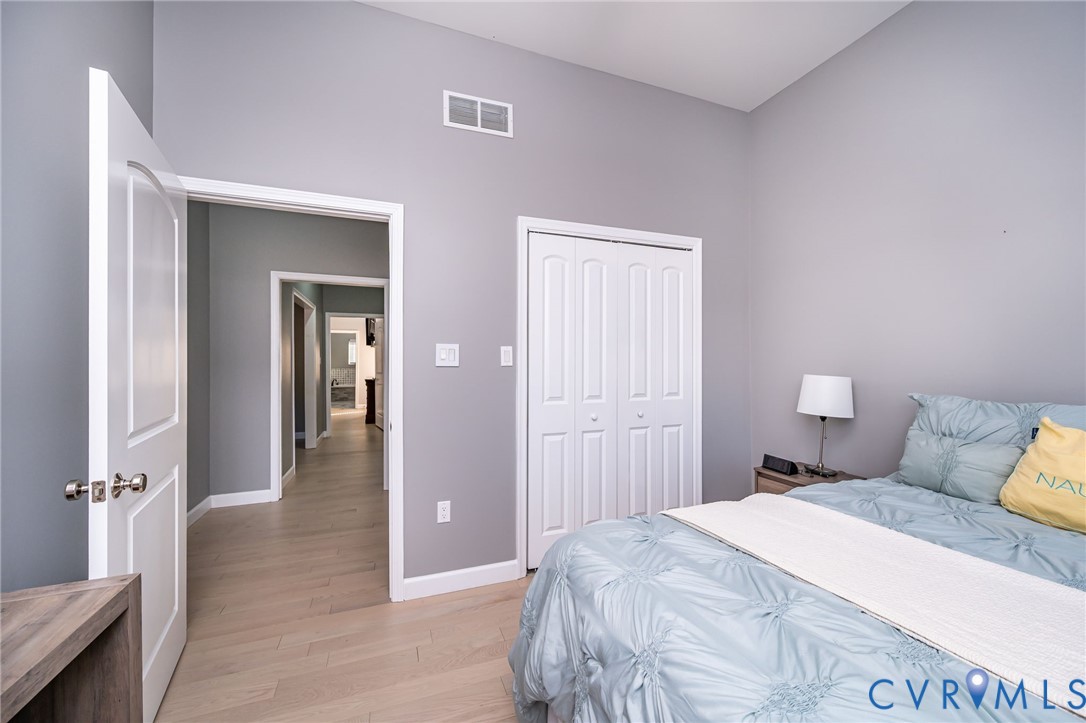 11534 Georgetown Road Mechanicsville, VA 23116 - Photo 23 of 37 a bedroom with a bed and a table