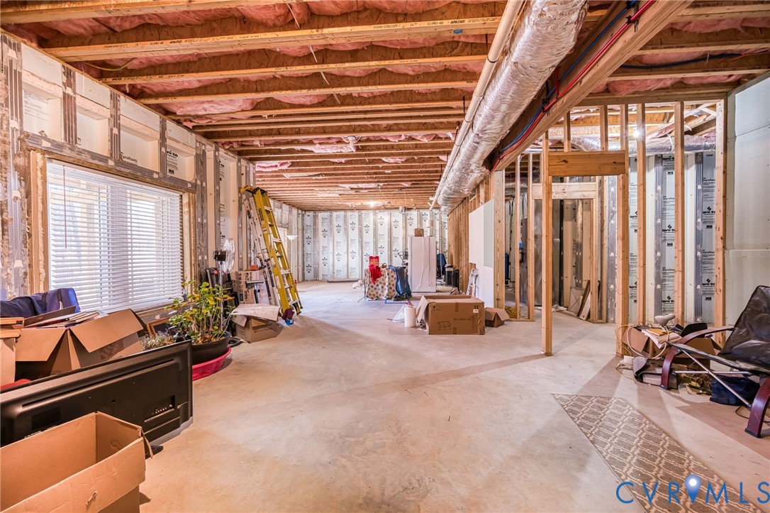 11534 Georgetown Road Mechanicsville, VA 23116 - Photo 27 of 37 a view of a room with gym equipment and furniture