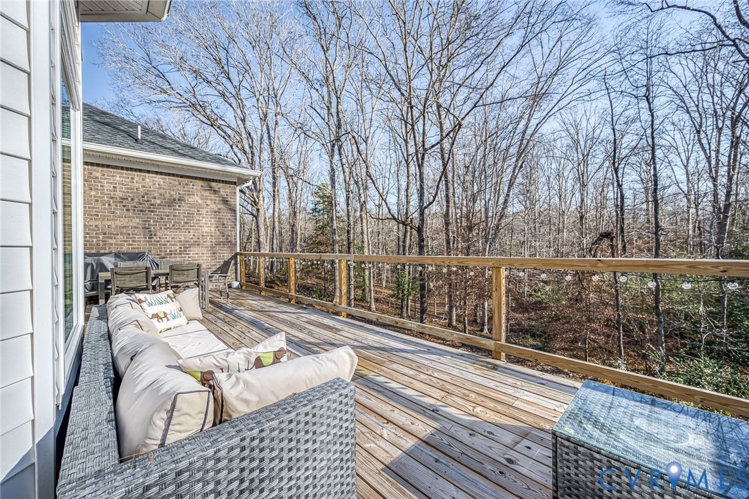 11534 Georgetown Road Mechanicsville, VA 23116 - Photo 33 of 37 a view of balcony with couch and wooden floor