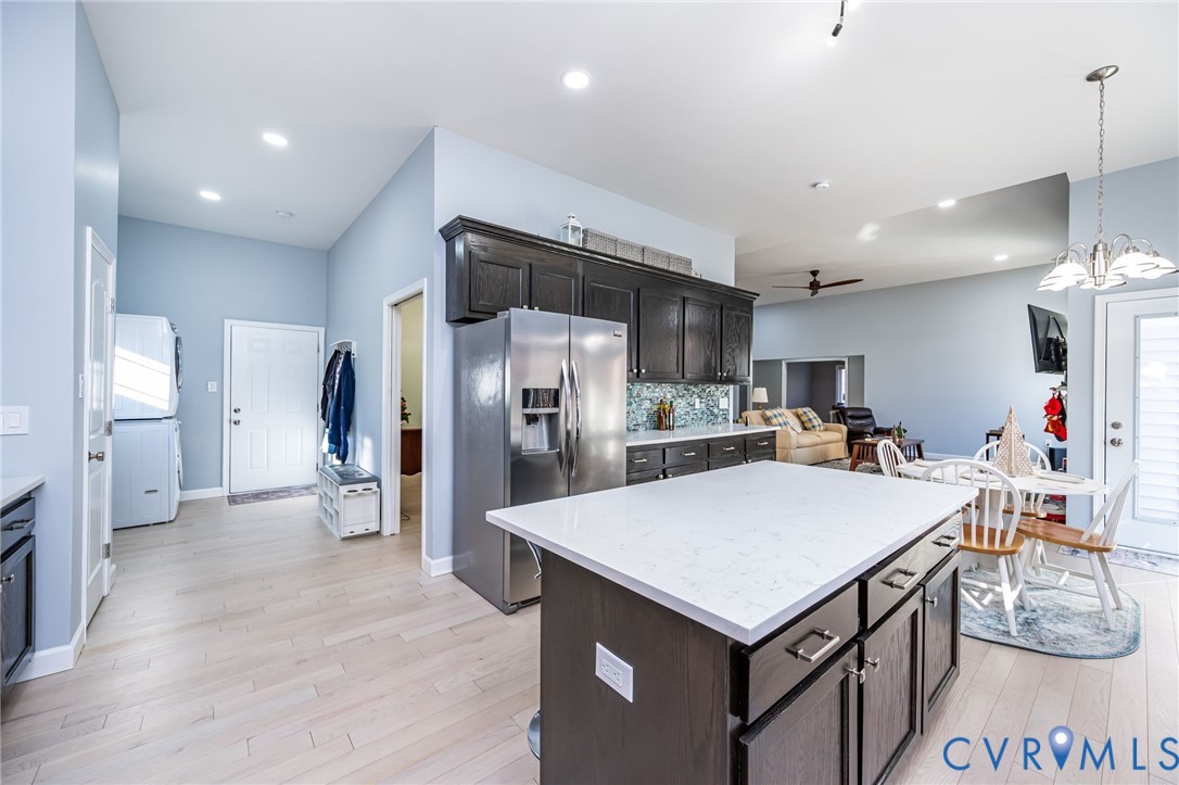 11534 Georgetown Road Mechanicsville, VA 23116 - Photo 8 of 37 a kitchen with stainless steel appliances a table and chairs in it