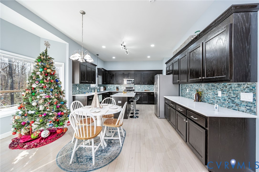 11534 Georgetown Road Mechanicsville, VA 23116 - Photo 9 of 37 a kitchen with granite countertop stainless steel appliances lots of counter space cabinets and furniture