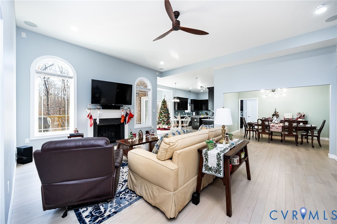11534 Georgetown Road Mechanicsville, VA 23116 - Photo 10 of 37 a living room with furniture a fireplace and a flat screen tv