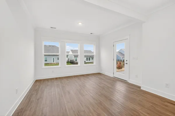 a view of kitchen with granite countertop stainless steel appliances sink and cabinets
