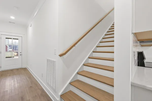 a view of a hallway with windows