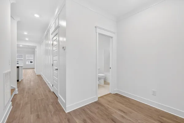 a kitchen with kitchen island a sink and a stove top oven