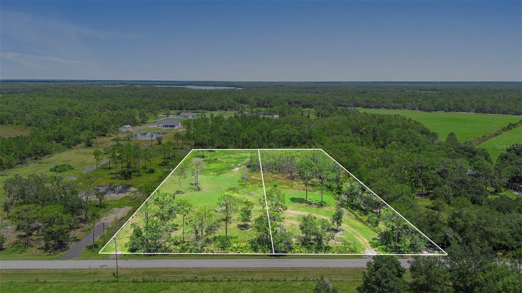 4365 Lake Gentry Road St. Cloud, FL 34772 - Photo 5 of 10 a view of a yard with a lake view