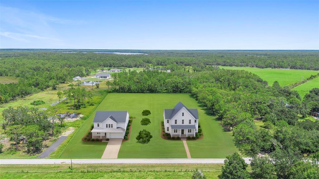 4365 Lake Gentry Road St. Cloud, FL 34772 - Photo 8 of 10 an aerial view of a house with garden view