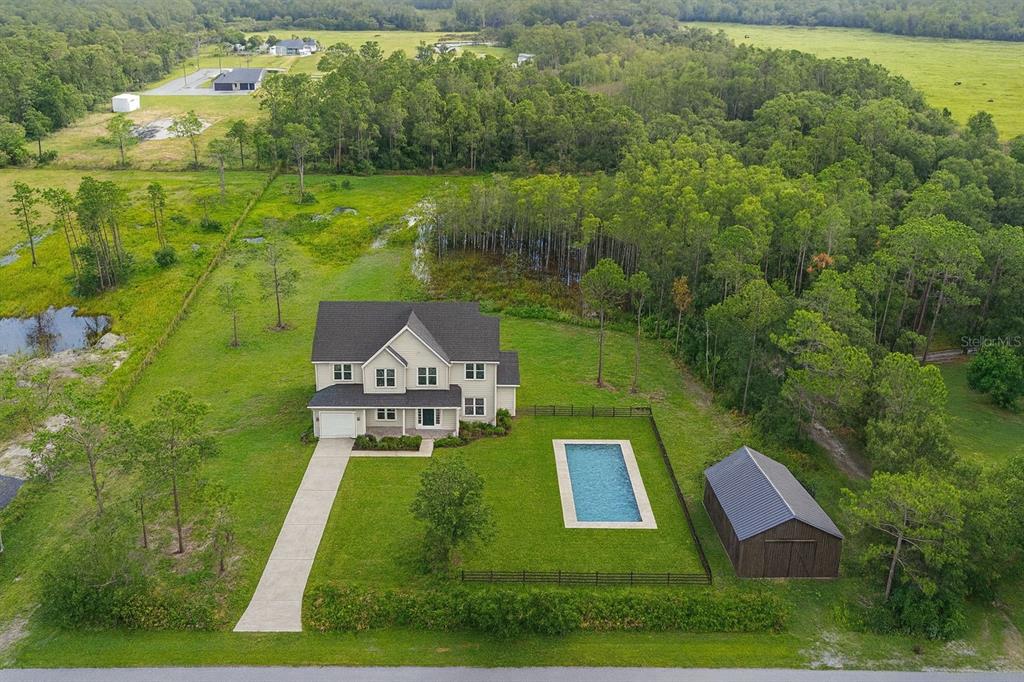 4365 Lake Gentry Road St. Cloud, FL 34772 - Photo 9 of 10 a view of a house with a yard