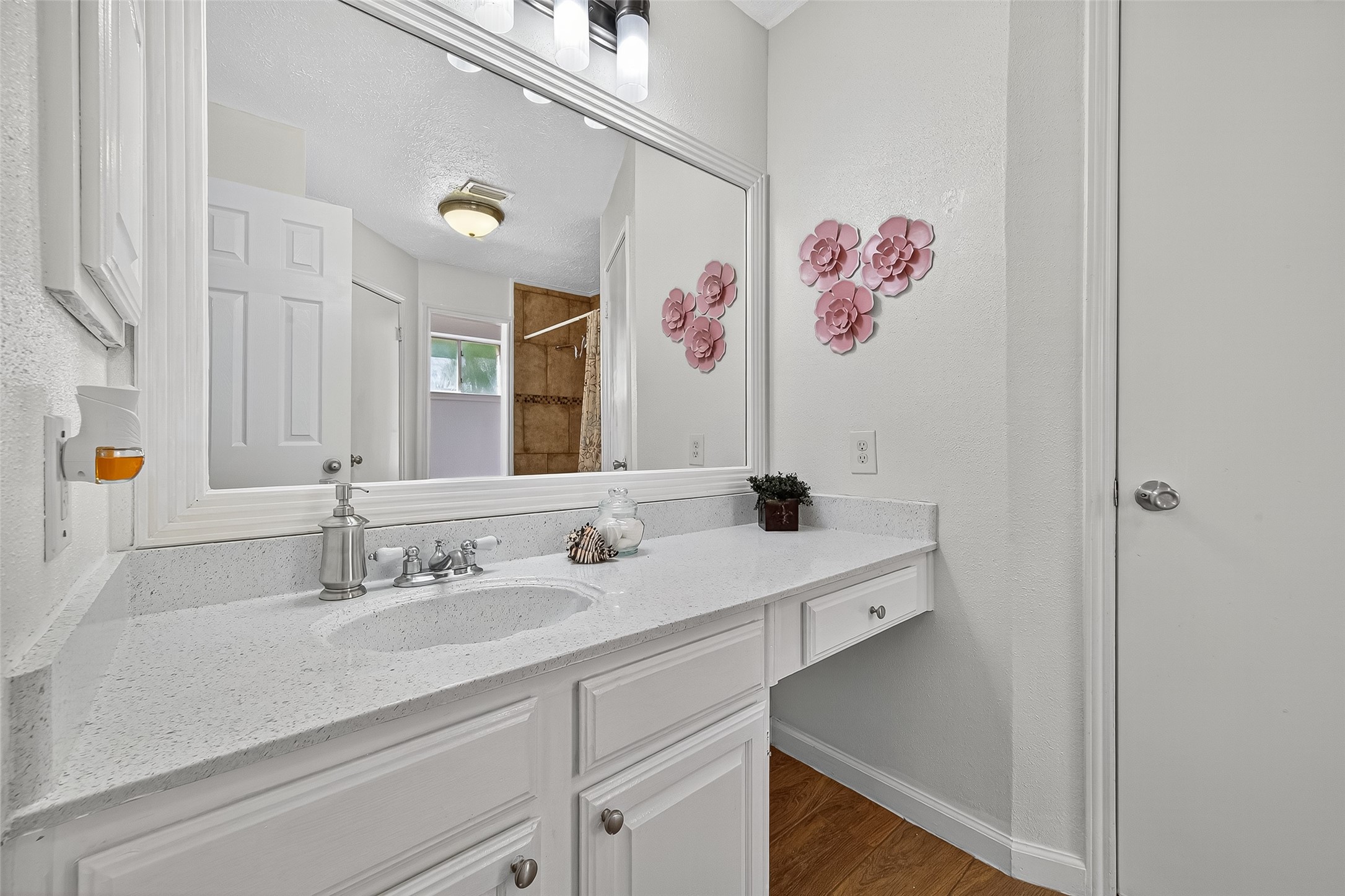 5323 Windsong Trail Houston, TX 77084 - Photo 17 of 30 This spacious bathroom features a refreshed vanity with ample counter space and storage, modern lighting