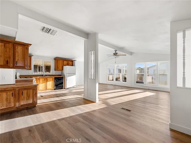 a view of a kitchen with an oven and white cabinets