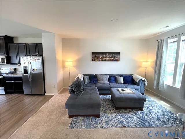 a living room with furniture and a rug
