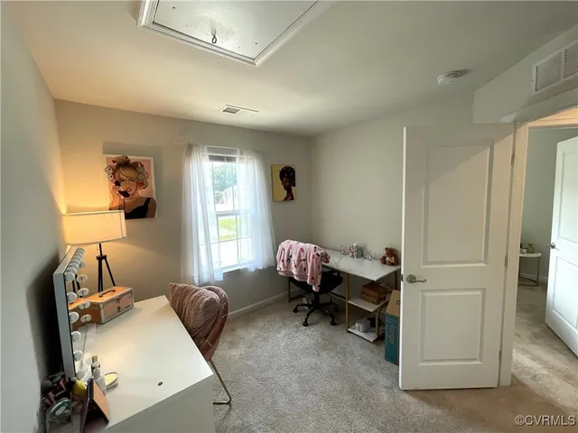 a room with a window and gym equipment