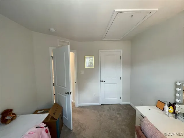 a bedroom with a bed and cabinets