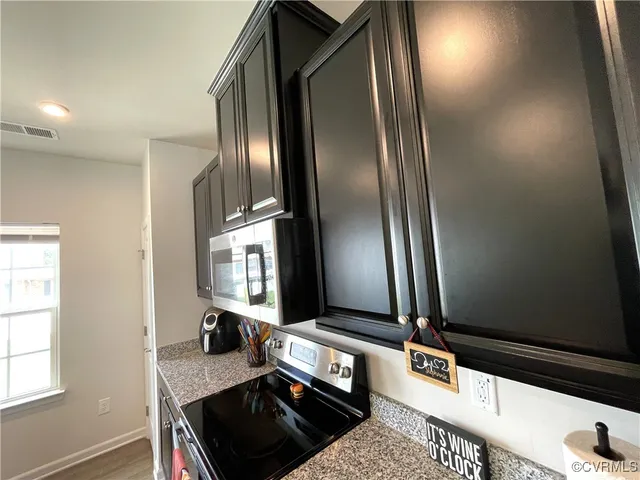 a kitchen with a sink and a refrigerator