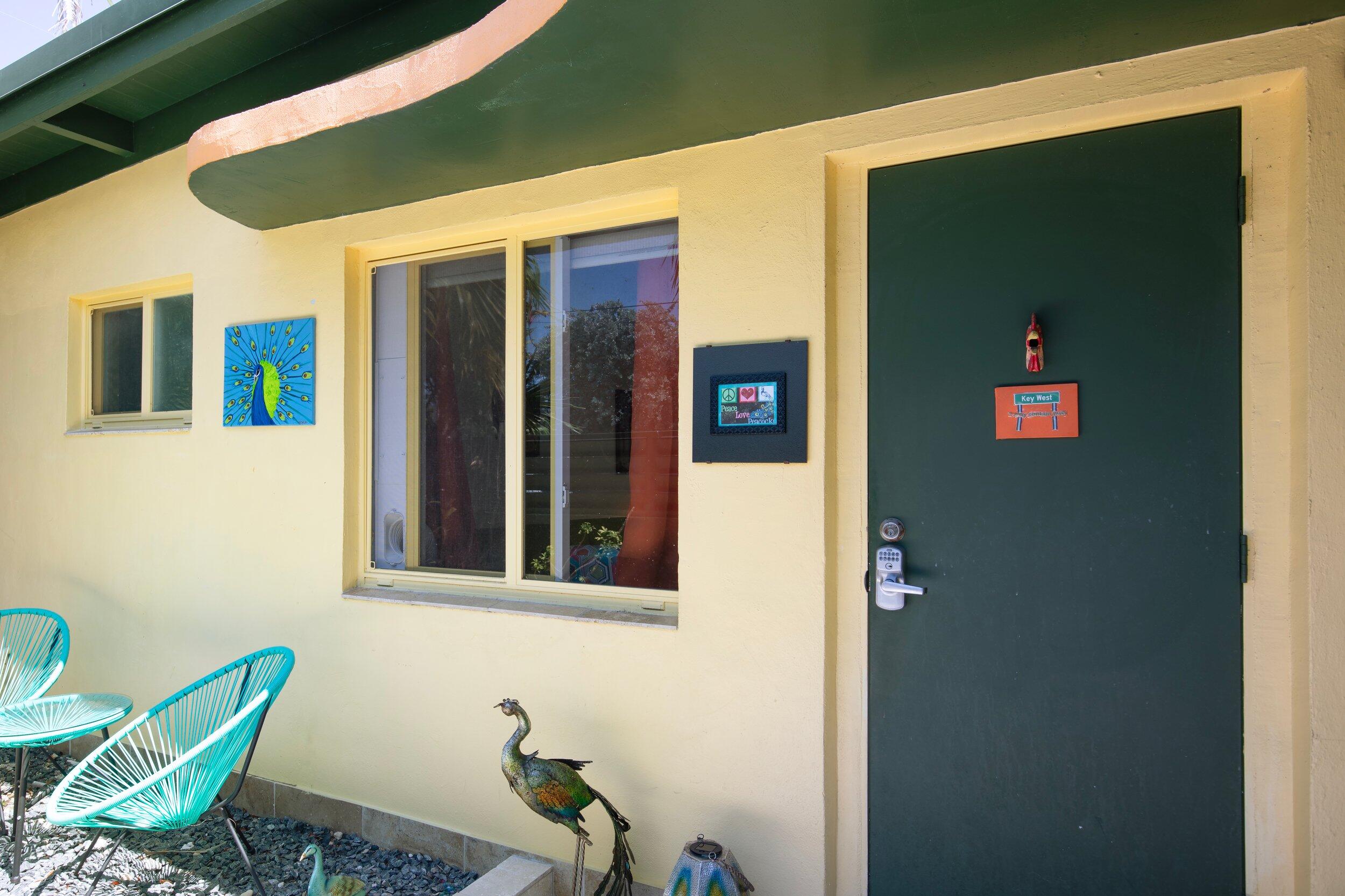 1519 Florida Street Key West, FL 33040 - Photo 46 of 86 a view of a door and chair in front of a house