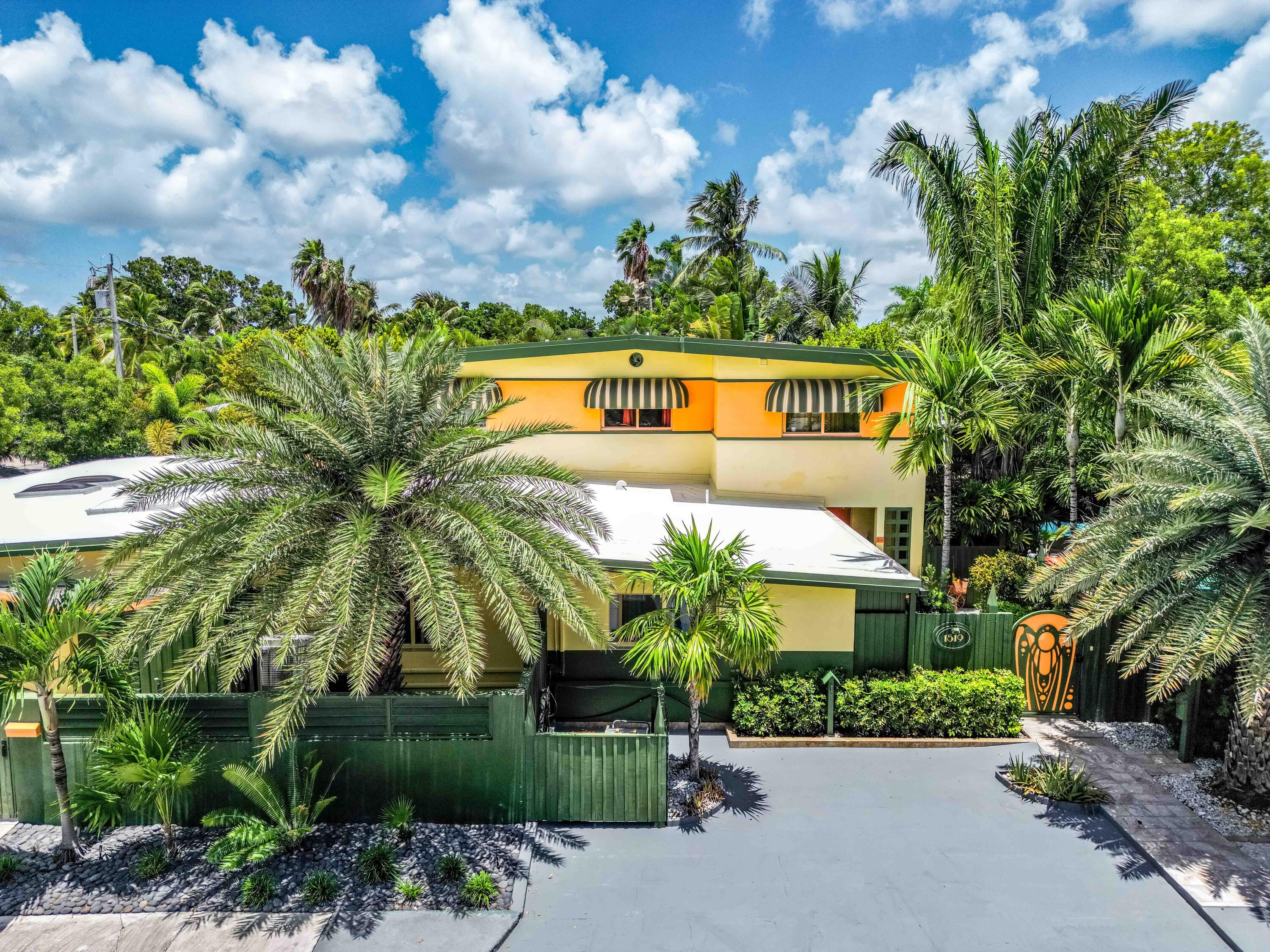1519 Florida Street Key West, FL 33040 - Photo 5 of 86 a front view of a house with a yard and outdoor seating