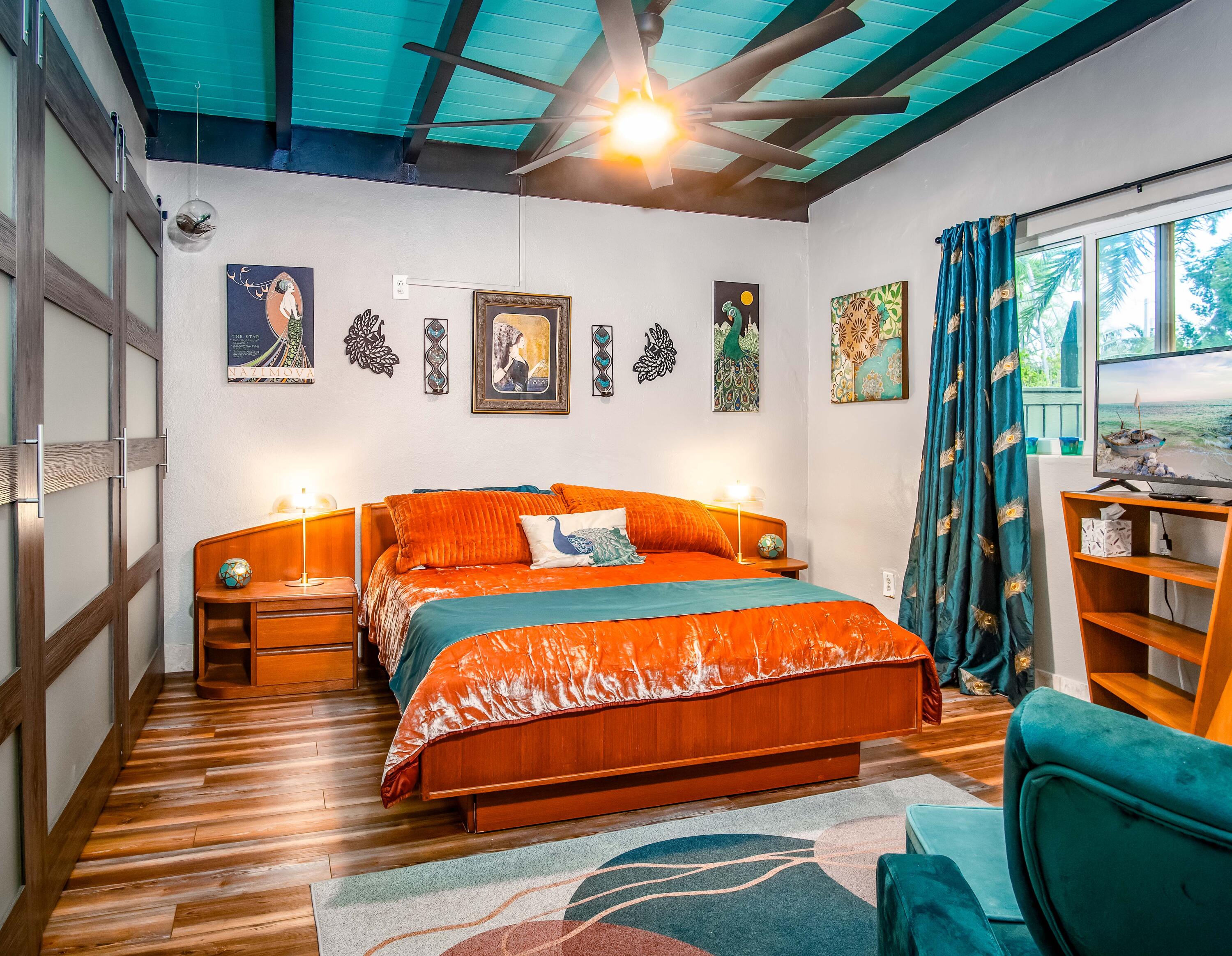 1519 Florida Street Key West, FL 33040 - Photo 56 of 86 a bedroom with a bed and a book shelf