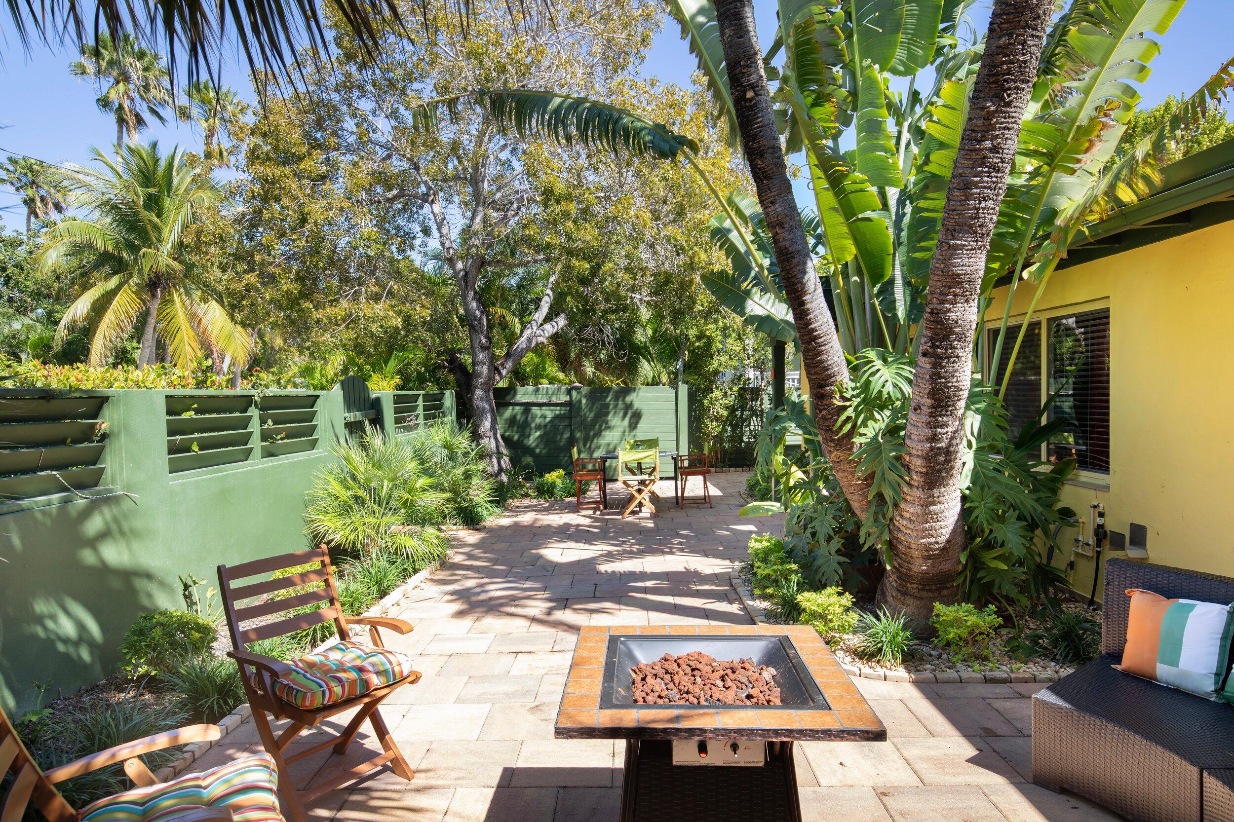 1519 Florida Street Key West, FL 33040 - Photo 66 of 86 a view of a patio with table and chairs and potted plants
